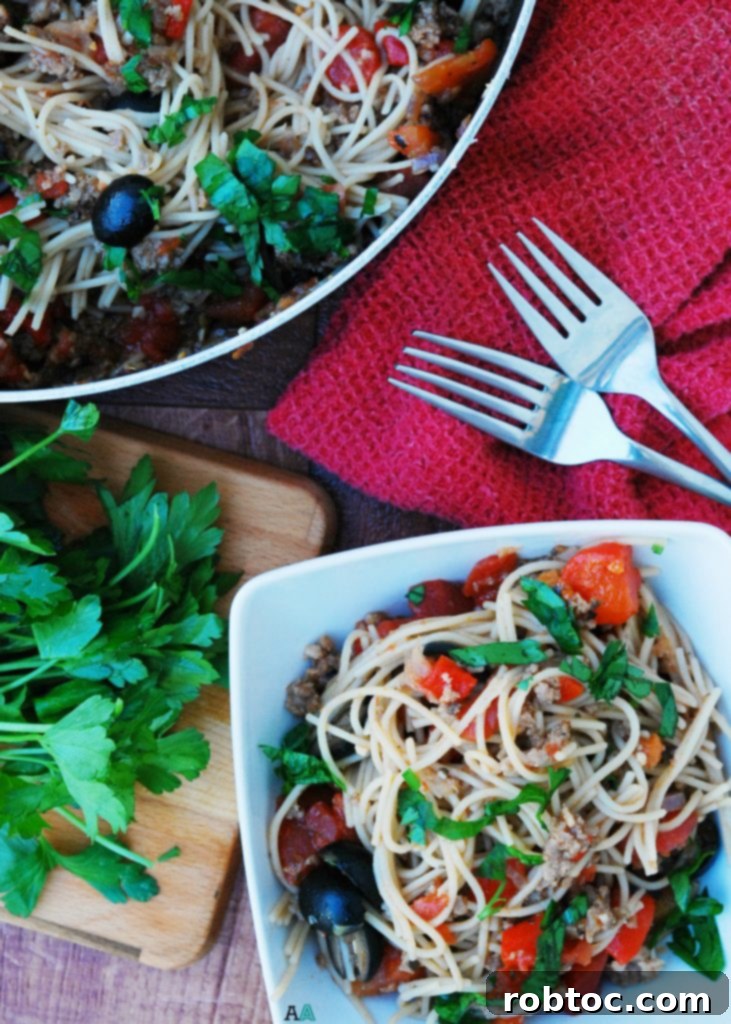 Close-up of 30-Minute Gluten-Free Sausage and Peppers Pasta with fresh herbs