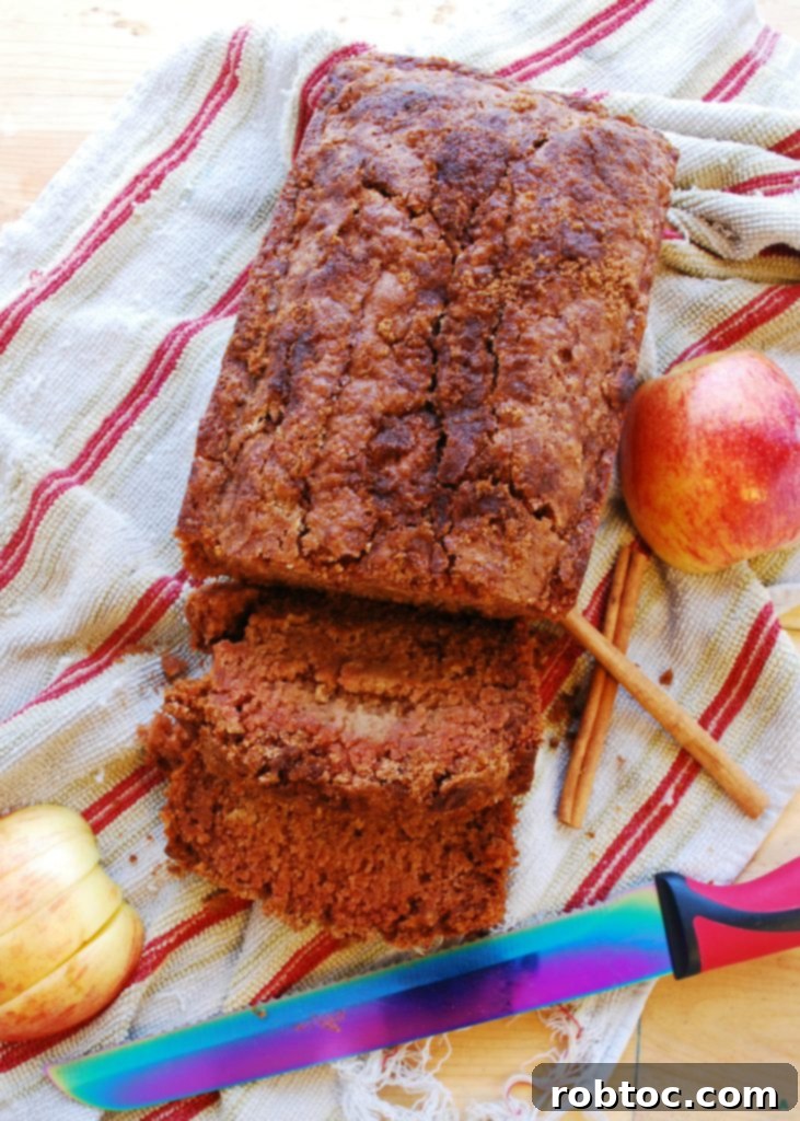 A perfectly baked slice of Applesauce Quick Bread, highlighting its moist, tender crumb, ideal for a gluten-free and vegan breakfast or snack.