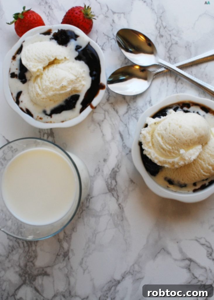 A beautifully presented slice of Slow Cooker Chocolate Lava Cake, showing off the rich cake texture and gooey chocolate pudding. This recipe is gluten-free, vegan, and free from the top 8 allergens, by AllergyAwesomeness.com.