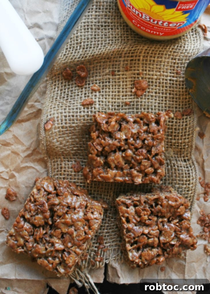 Delicious and allergy-friendly Inside Out Scotcheroos, a sweet and chewy snack perfect for kids. Made with SunButter and chocolate rice crispy cereal, this recipe is gluten-free, vegan, and top 8 allergen-free.