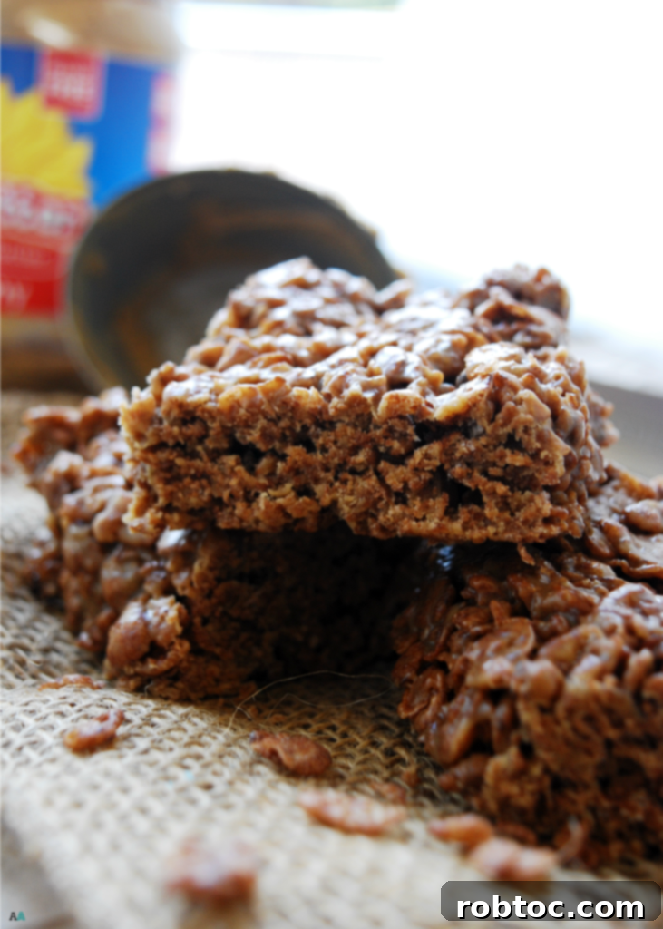 A perfectly cut square of Inside Out Scotcheroo, showcasing the crispy and chewy texture. This image emphasizes the delicious and safe treat for those with allergies.