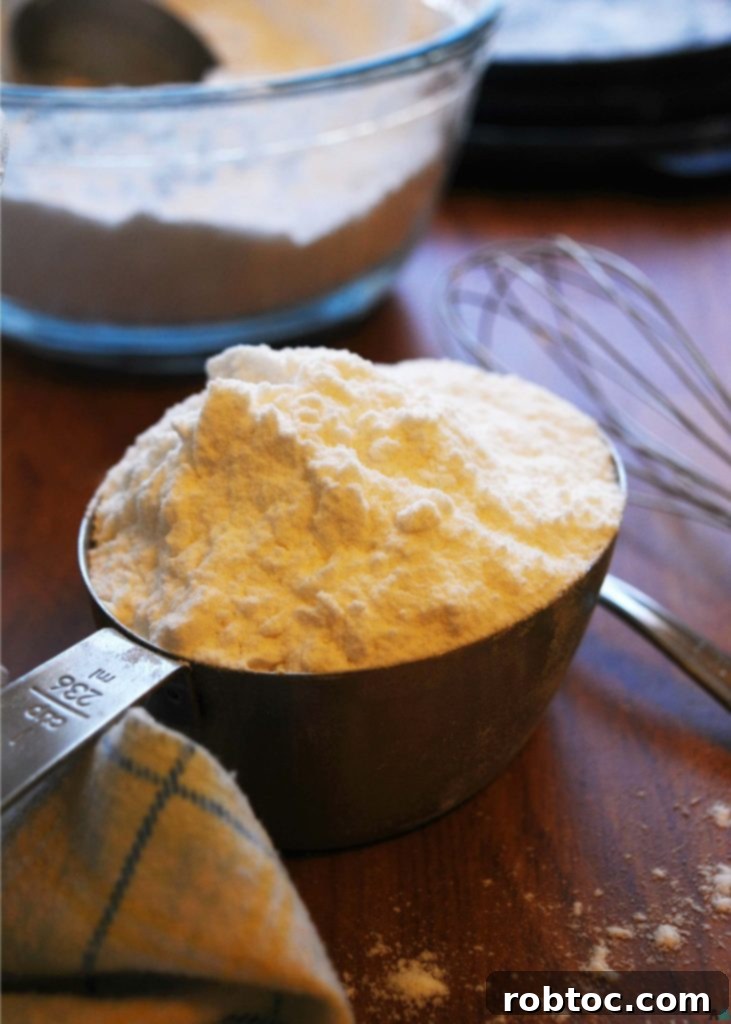 A close-up shot of the best homemade gluten-free flour mix, showing its finely ground texture, ready for baking. Suitable for gluten, dairy, egg, soy, peanut, and tree nut free diets, making it top 8 free and vegan.