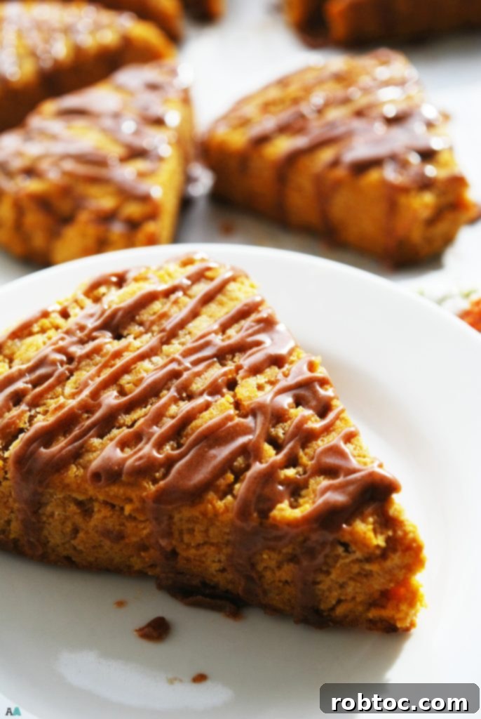 Delectable Top 8 Free Vegan Pumpkin Scones with Spiced Glaze 7 A plate of freshly baked gluten-free vegan pumpkin scones with spiced glaze