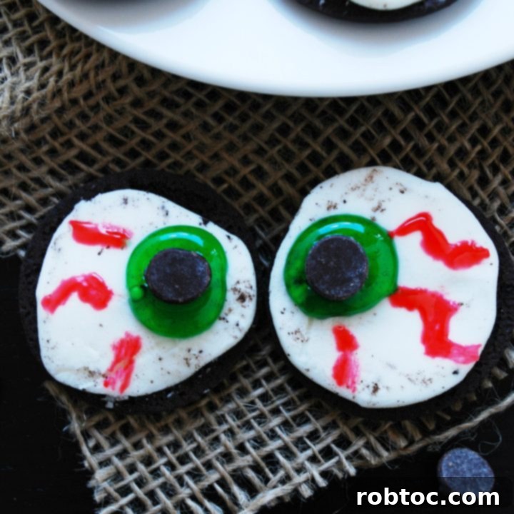 Delicious no-bake Monster Eyeballs with chocolate chips, green and red food coloring, perfect for an allergy-friendly Halloween.