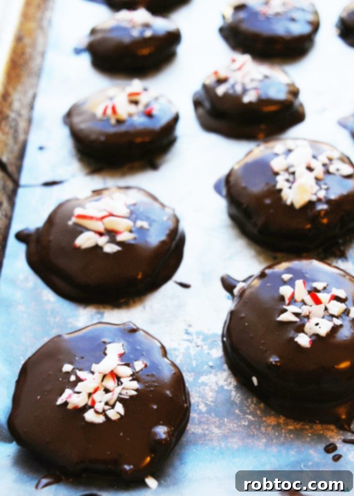 Tray of freshly made Dairy-free Homemade Peppermint Patties with festive sprinkles, a top 8 free and vegan holiday dessert recipe from AllergyAwesomeness.com