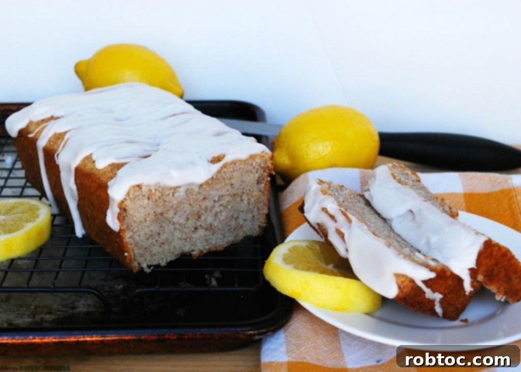 Sunshine Lemon Loaf with Tangy Glaze: Vegan & Top 8 Allergen-Friendly 4 Delicious lemon bread loaf cooling on a wire rack, ready for glazing