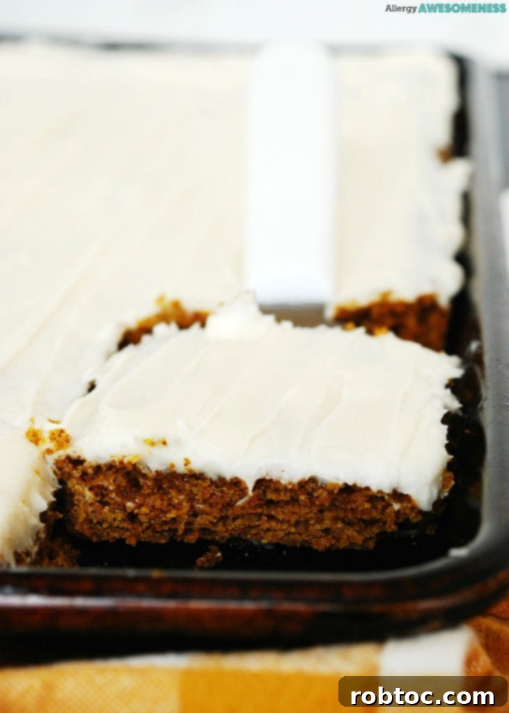 vegan-gluten-free-carrot-sheet-cake-recipe-taking-a-slice-out