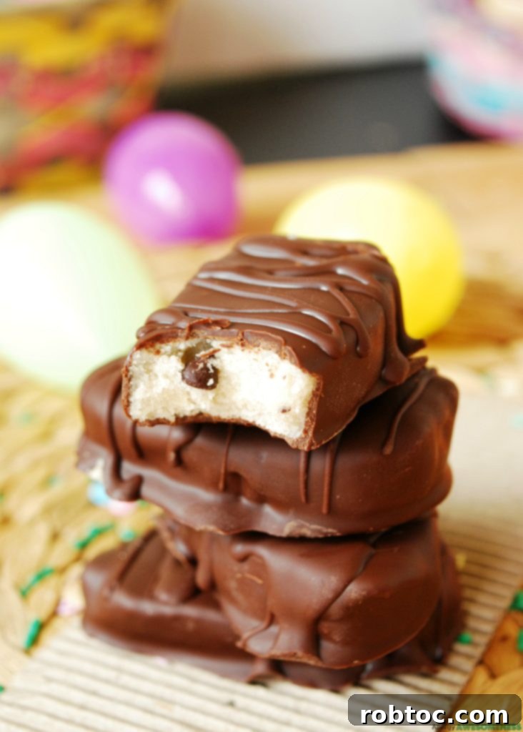 Beautifully arranged vegan chocolate cookie dough Easter eggs with sprinkles.