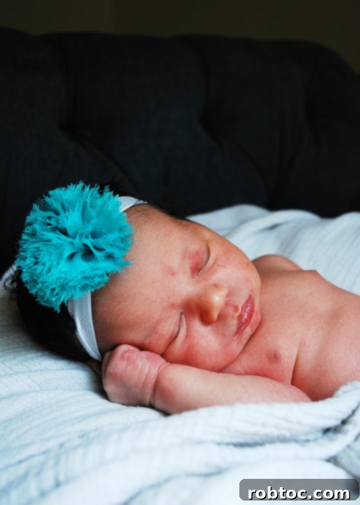Red White and Blue Popcorn: 3 Easy Ingredients, Allergy Safe 4 Newborn baby gently held, symbolizing the joy and busy life of a new parent, which inspired quick recipes.