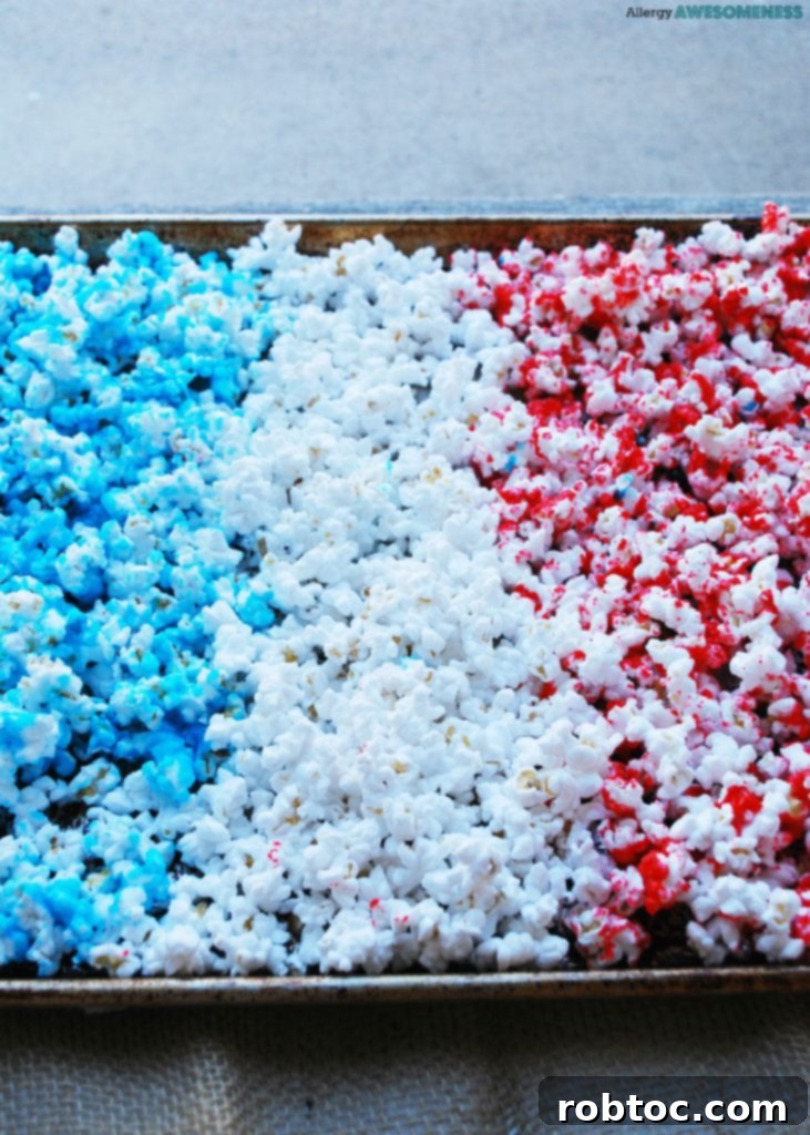 Red White and Blue Popcorn: 3 Easy Ingredients, Allergy Safe 5 A bowl of vibrant 4th of July Snack popcorn, featuring red, white, and blue kernels, perfect for a festive gathering.