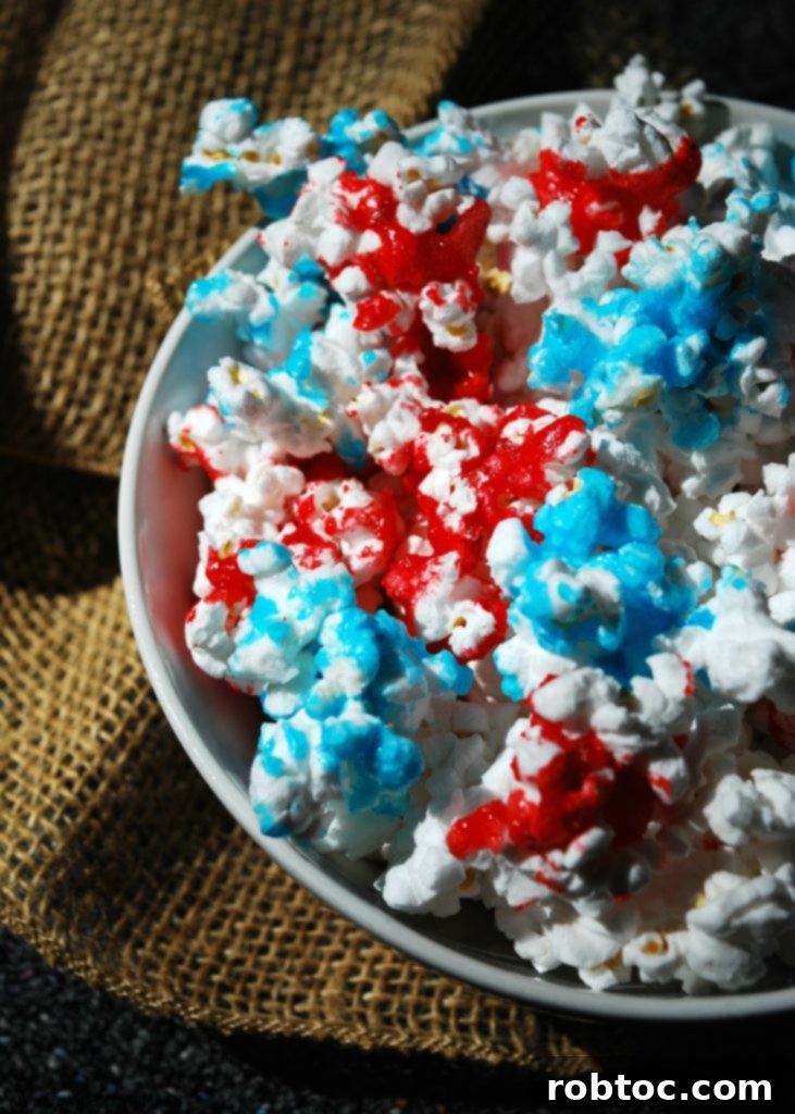 Red White and Blue Popcorn: 3 Easy Ingredients, Allergy Safe 6 Hands reaching for a bowl of No Bake 4th of July Treat popcorn, displaying its festive colors and tempting appeal.