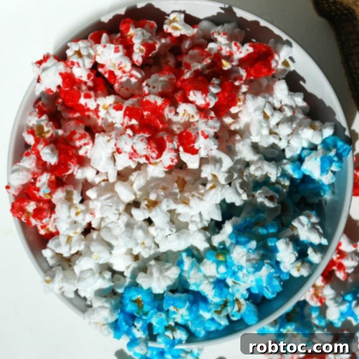 Patriotic Popcorn Recipe, a vibrant red, white, and blue snack perfect for Fourth of July celebrations.