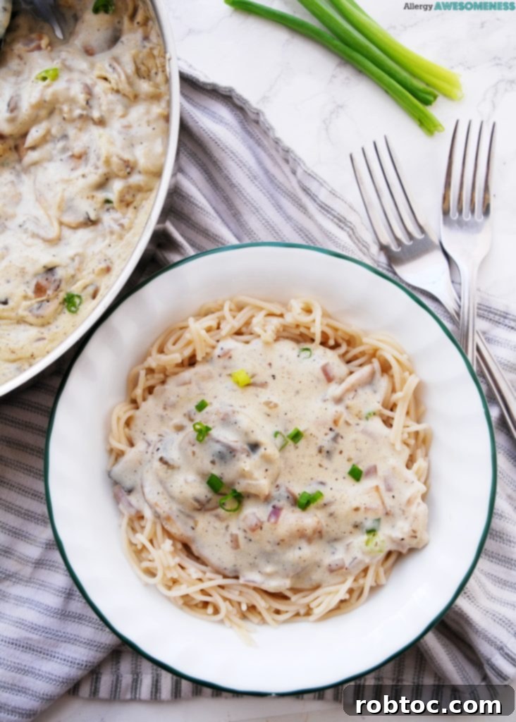 Rich and creamy vegan mushroom stroganoff served over gluten-free noodles