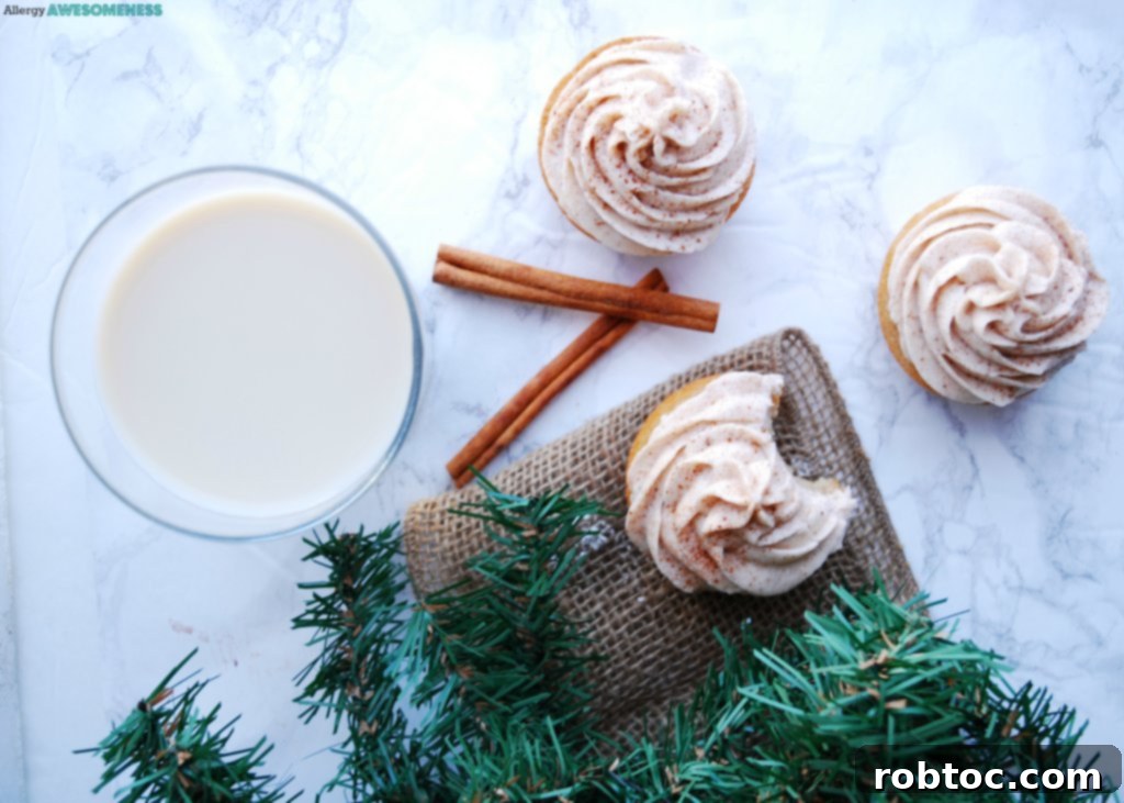 Delicious dairy-free eggnog cupcakes topped with creamy spiced frosting