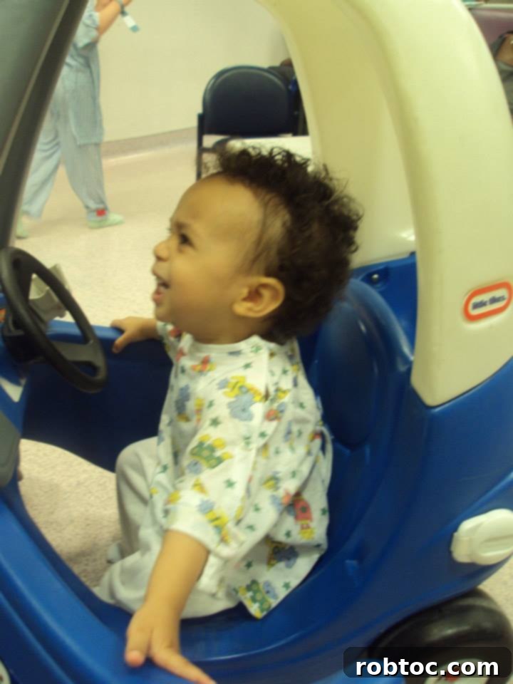 A young child waiting patiently for an EOE scope procedure, highlighting the routine nature of medical interventions.