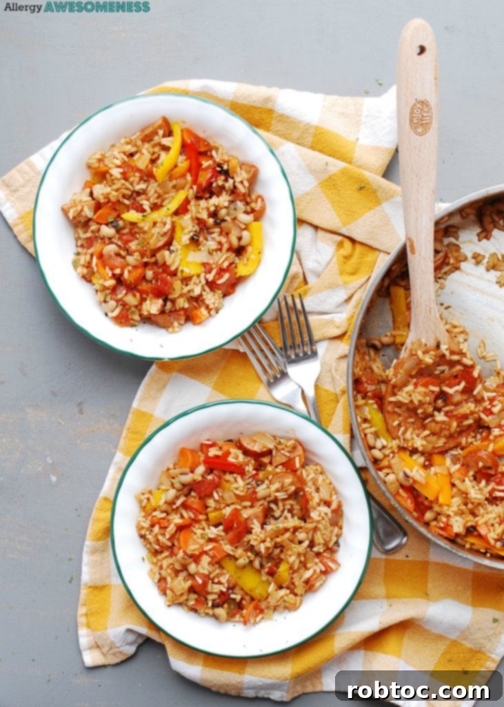 Gluten-free 30-minute skillet jambalaya in a rustic skillet on a wooden surface