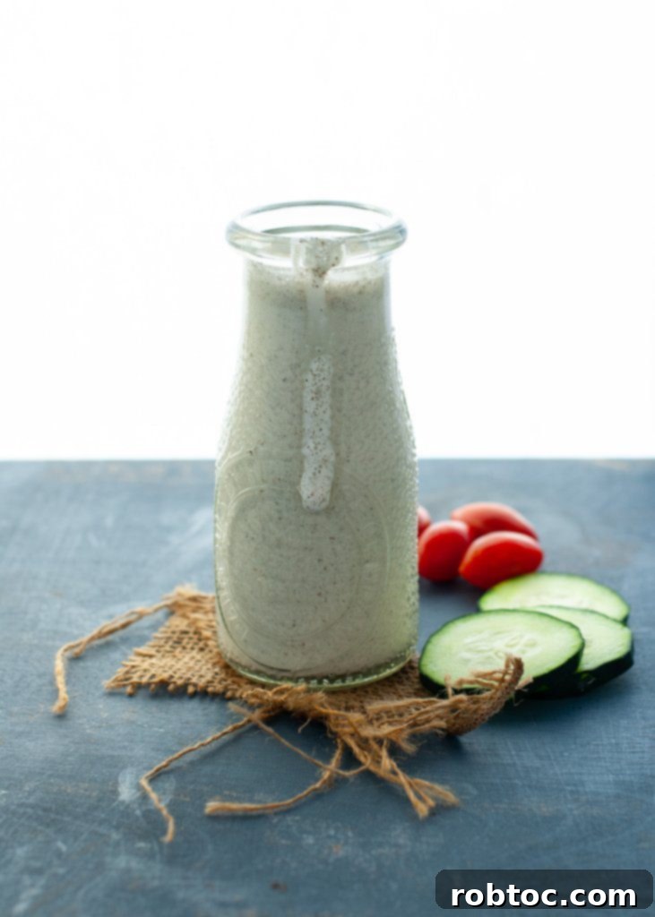 Vibrant Vegan Greek Salad with Creamy Tzatziki 4 Detailed shot of how to make homemade vegan tzatziki sauce in a blender, showing fresh ingredients