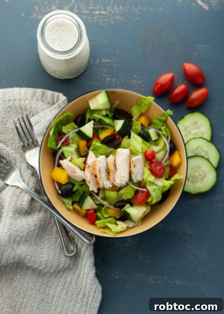 Vibrant Vegan Greek Salad with Creamy Tzatziki 5 Dairy-free Greek salad with homemade dairy-free tzatziki sauce, served in a bowl