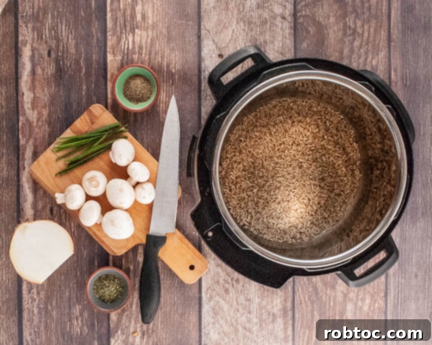 Ingredients for Instant Pot Mushroom Rice Pilaf laid out on a kitchen counter.