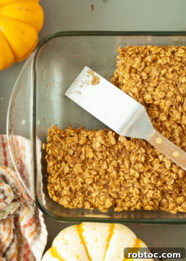 Vegan Gluten Free Baked Pumpkin Oatmeal 5 Allergy-friendly baked pumpkin oatmeal in the pan with one piece already cut out and removed