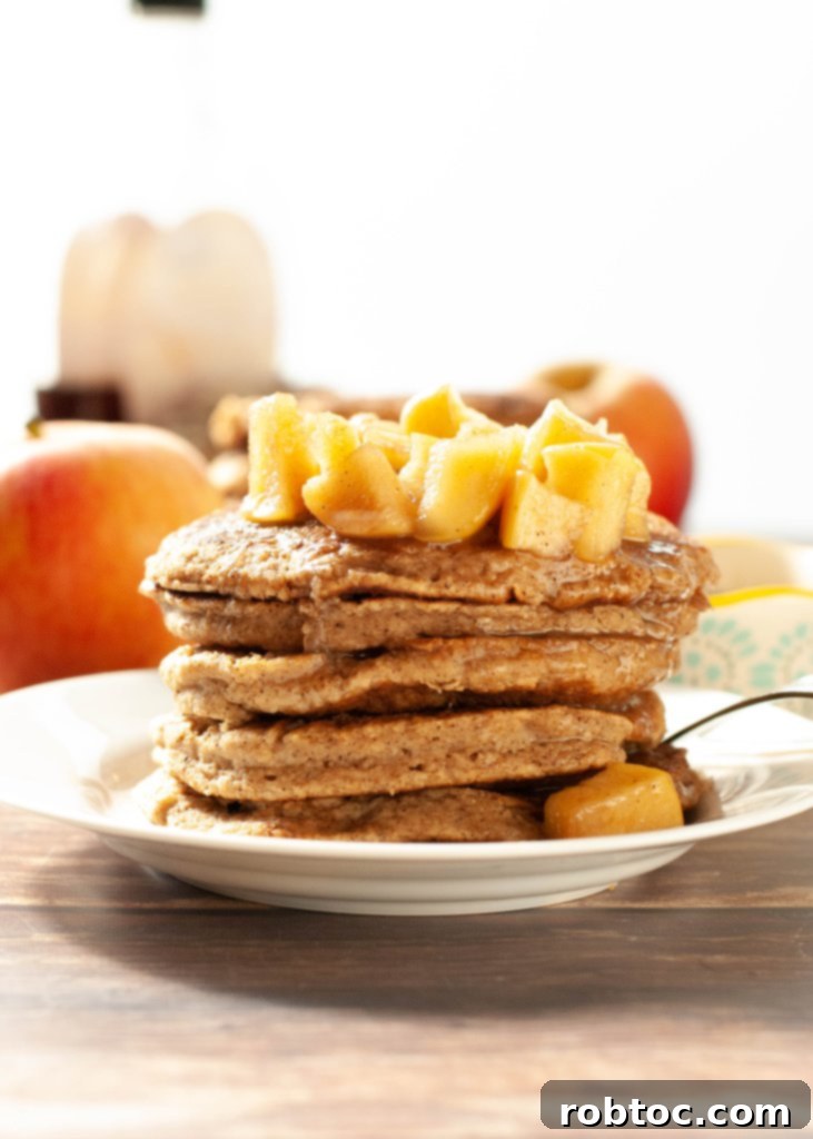 Close-up of fluffy applesauce oatmeal pancakes, showcasing their soft texture and golden-brown edges.
