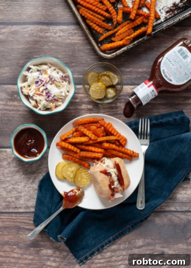 A plate of gluten-free and dairy-free BBQ chicken sliders with sides, highlighting a delicious and inclusive meal.