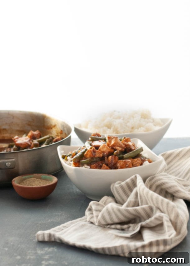 Black Pepper Chicken & Green Beans (Gluten-Free) 4 A vibrant bowl of Gluten-Free Black Pepper Chicken with green beans and rice, a perfect Asian dinner