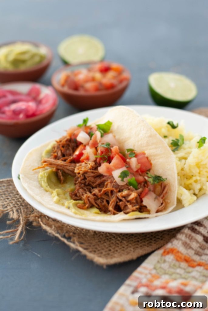 easy-slow-cooker-pork-tacos with vibrant toppings