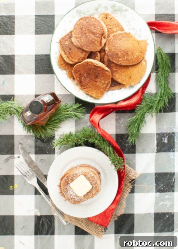 Close-up of fluffy egg-free gingerbread pancakes on a plate with syrup, ready to eat