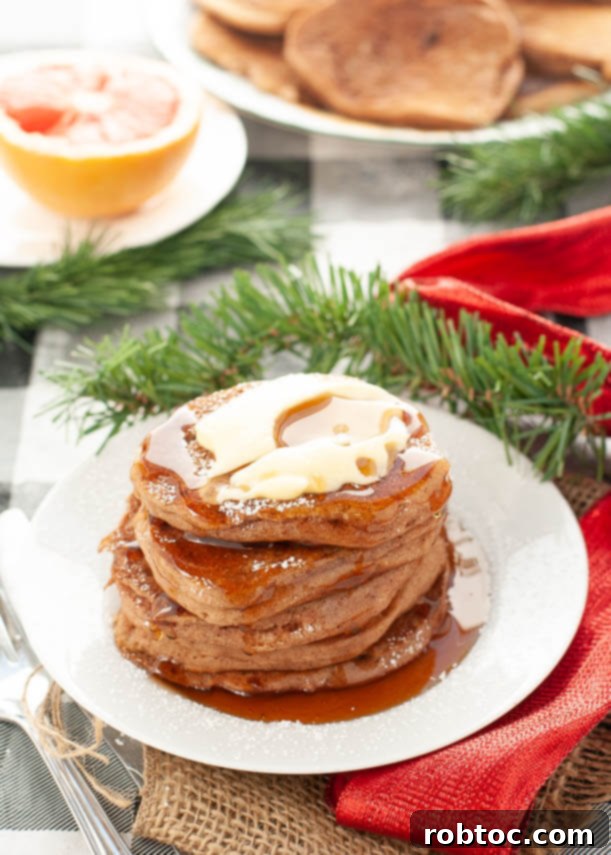 Beautifully styled plate of vegan gluten-free gingerbread pancakes, perfect for holiday entertaining
