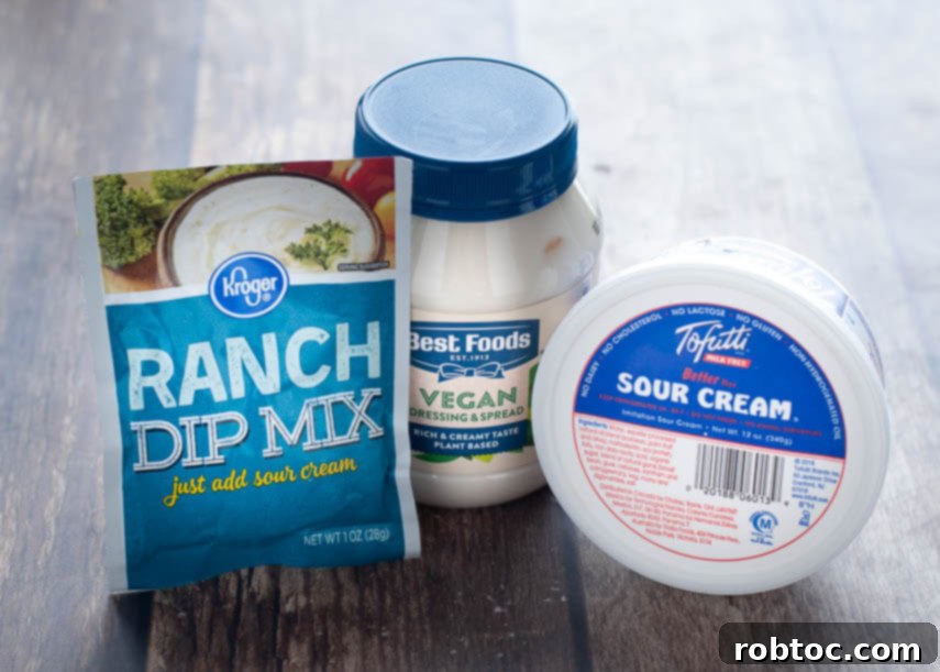 Creamy 3-Ingredient Vegan Ranch Dip 3 A bowl of thick, creamy 3-ingredient vegan ranch dip with carrots and celery sticks, highlighting its dipping suitability.