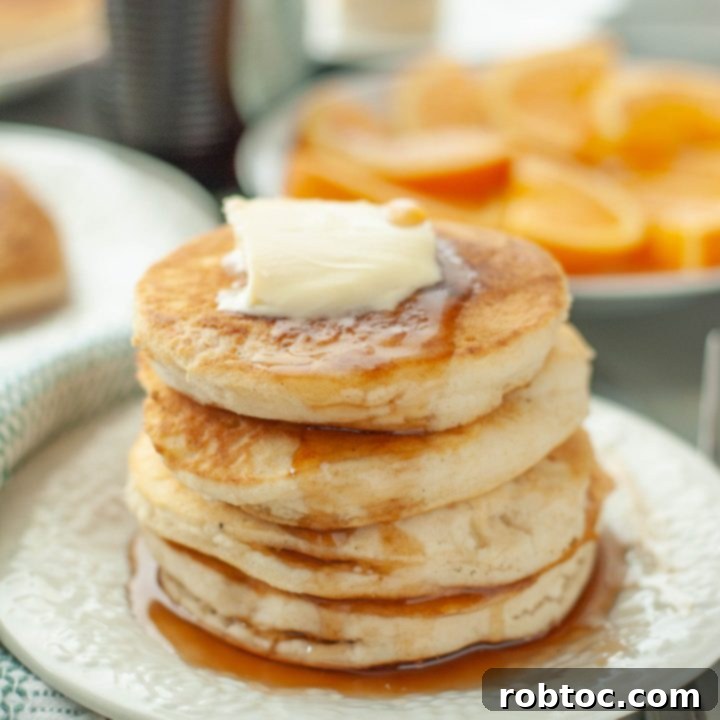 gluten-free-vegan-pancake-stack-with-butter-and-syrup-running-down