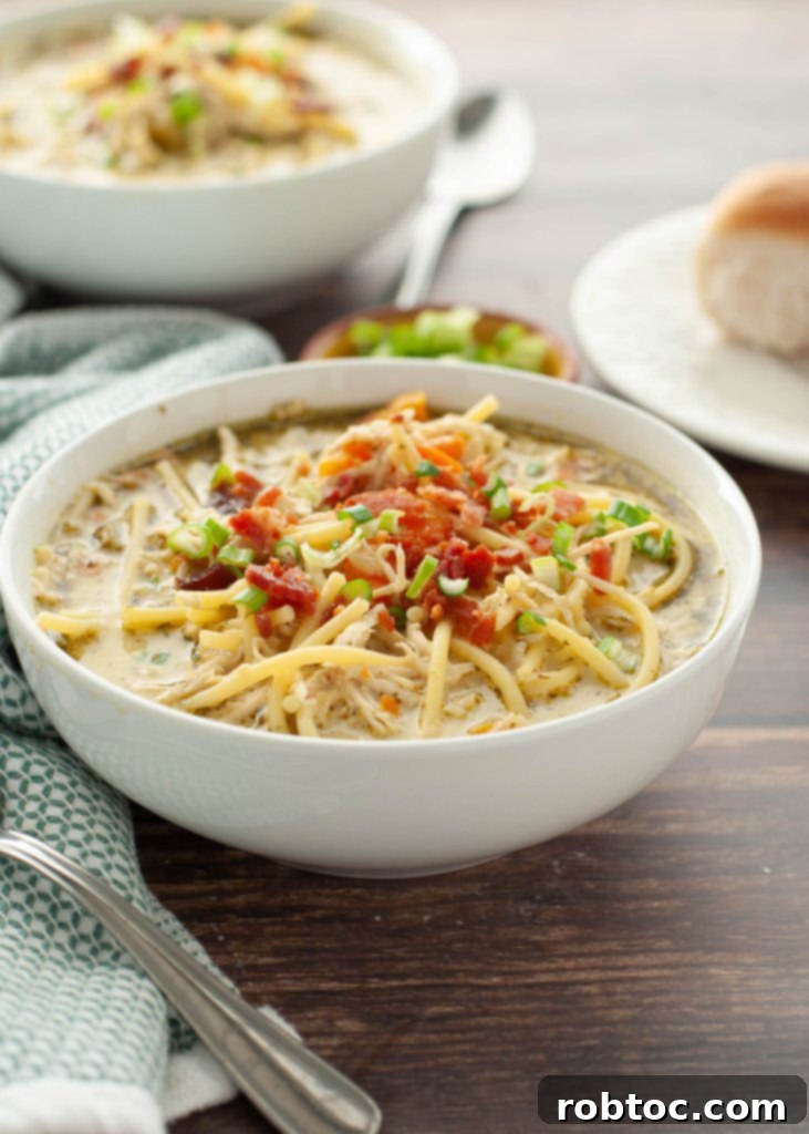 Irresistible Dairy-Free Chicken Noodle Soup Instant Pot and Stovetop 3 a close up shot of crack-chicken-noodle-soup-recipe-that's-gluten-and-dairy-free-in-a-white-bowl