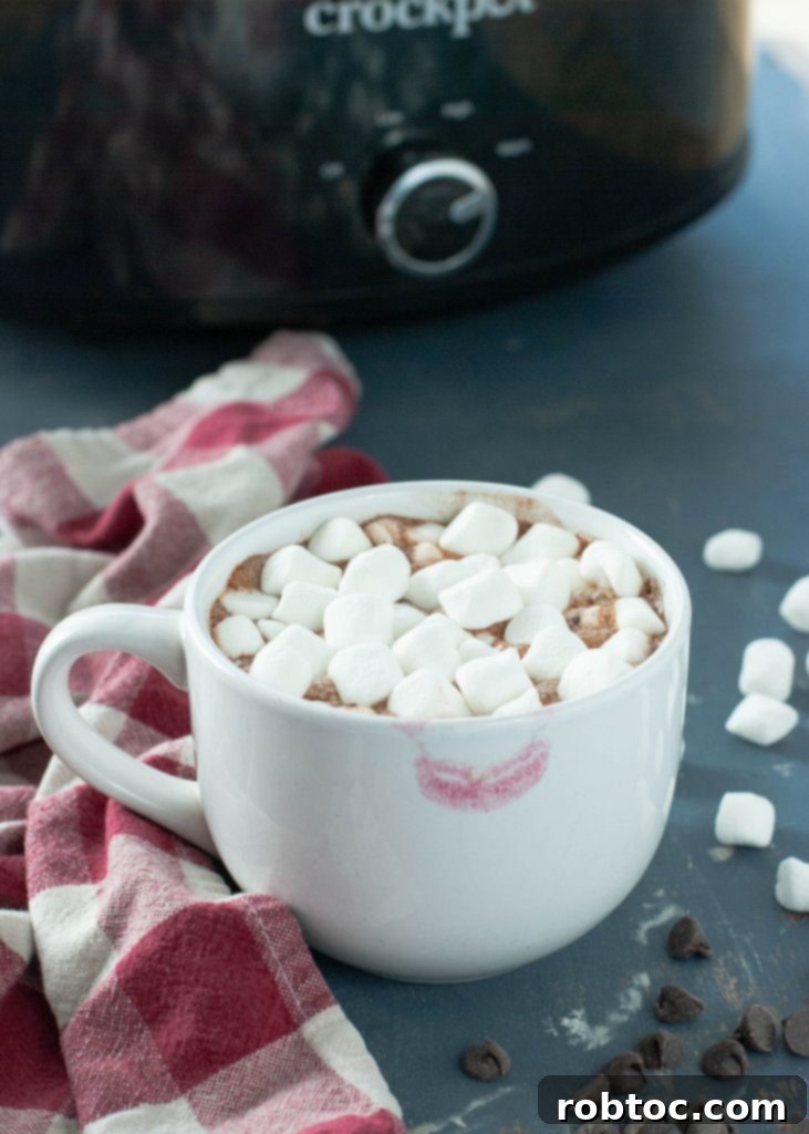 Large batch of dairy-free crock pot hot chocolate warming in a slow cooker.