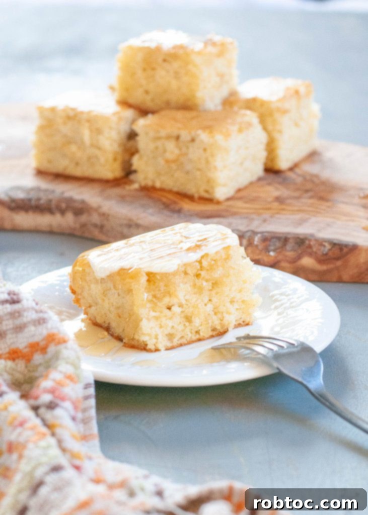 whole gluten-free dairy-free cornbread in a glass pan, ready to be sliced