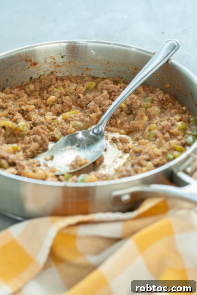 dairy-free-gluten-free-philly-cheesesteak-sloppy-joe-in-a-skillet-with-a-spoon-in-it