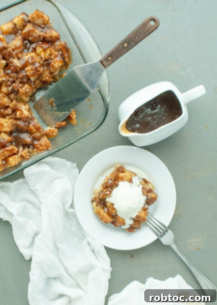 gluten-free-bread-pudding-next-to-pan-and-caramel-sauce-shot-above