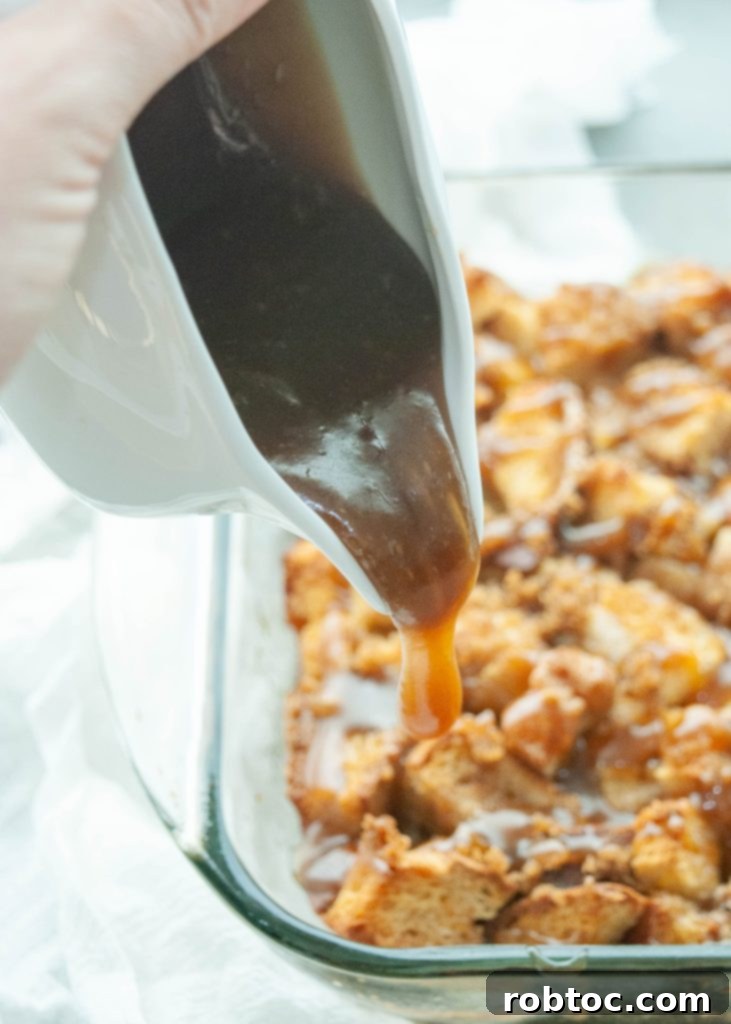 caramel-sauce-being-poured-over-gluten-free-bread-pudding