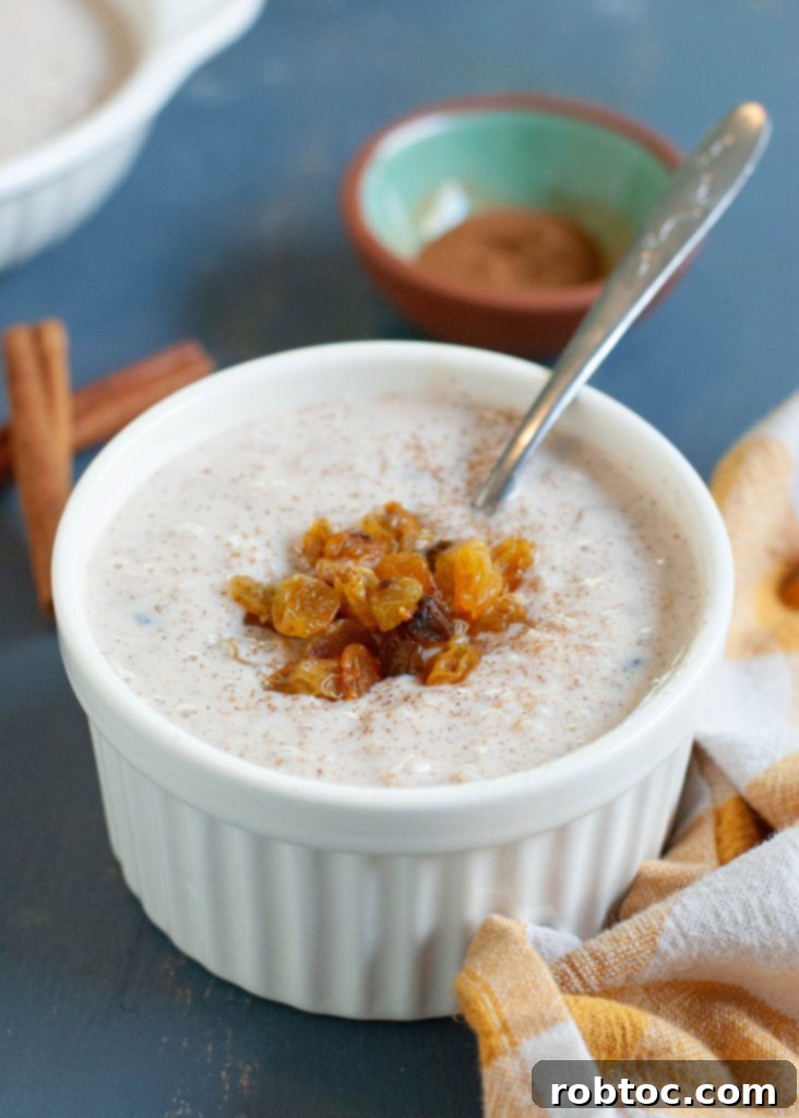 Creamy Gluten-Free Rice Pudding 6 egg-free-rice-pudding-recipe - Five small bowls of rice pudding, ready to be served.