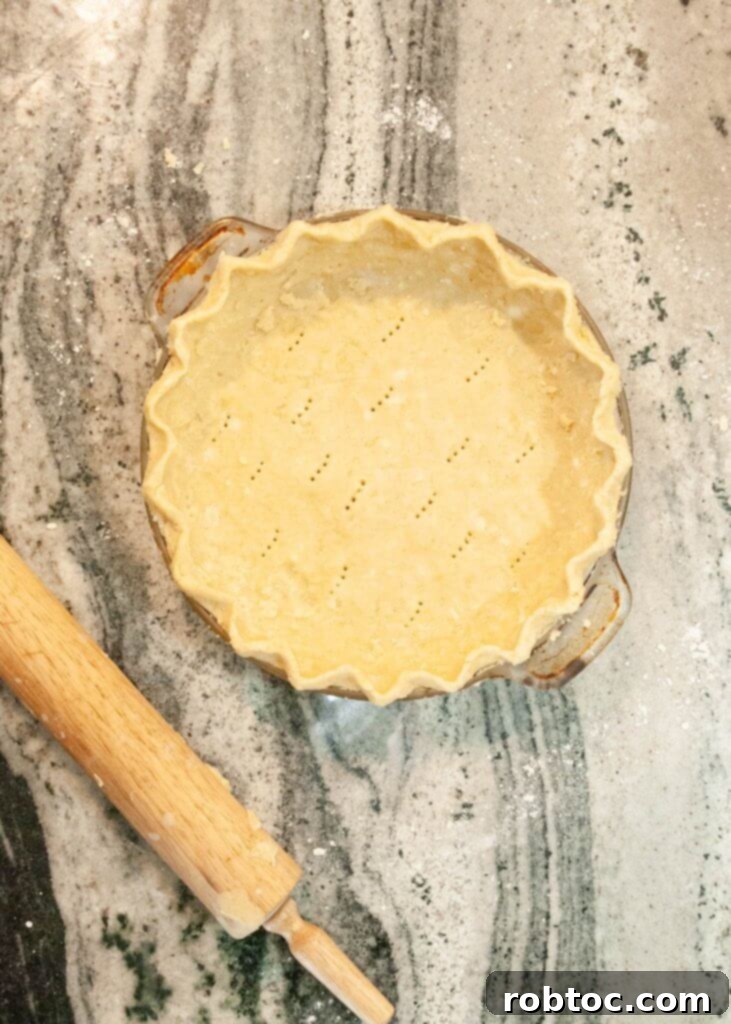 Gluten Free Pie Crust Tutorial 2 Delicious gluten-free pie crust with golden edges, ready for filling.