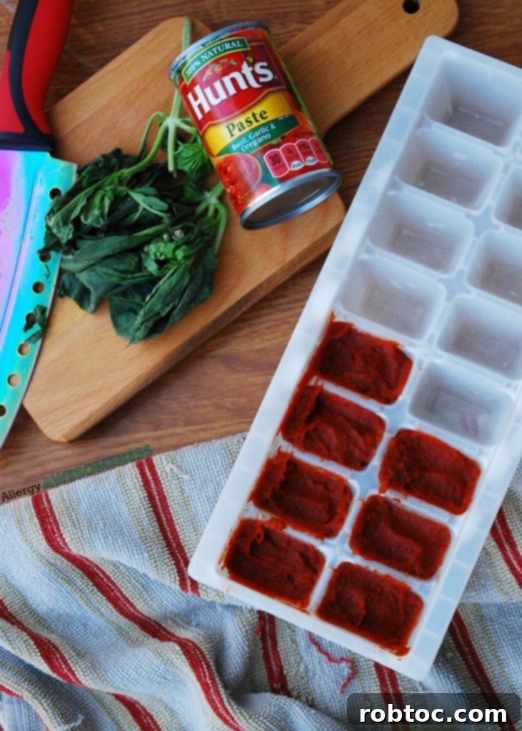 Slow Cooker Bolognese: Made for Everyone 7 Frozen portions of tomato paste in an ice cube tray, a clever kitchen hack.