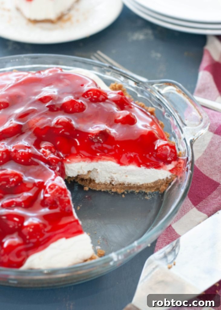 no bake cherry cheesecake with slice taken out