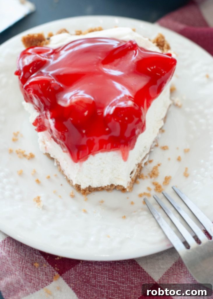 dairy-free-cherry-cheesecake-bitten-on-a-white-plate