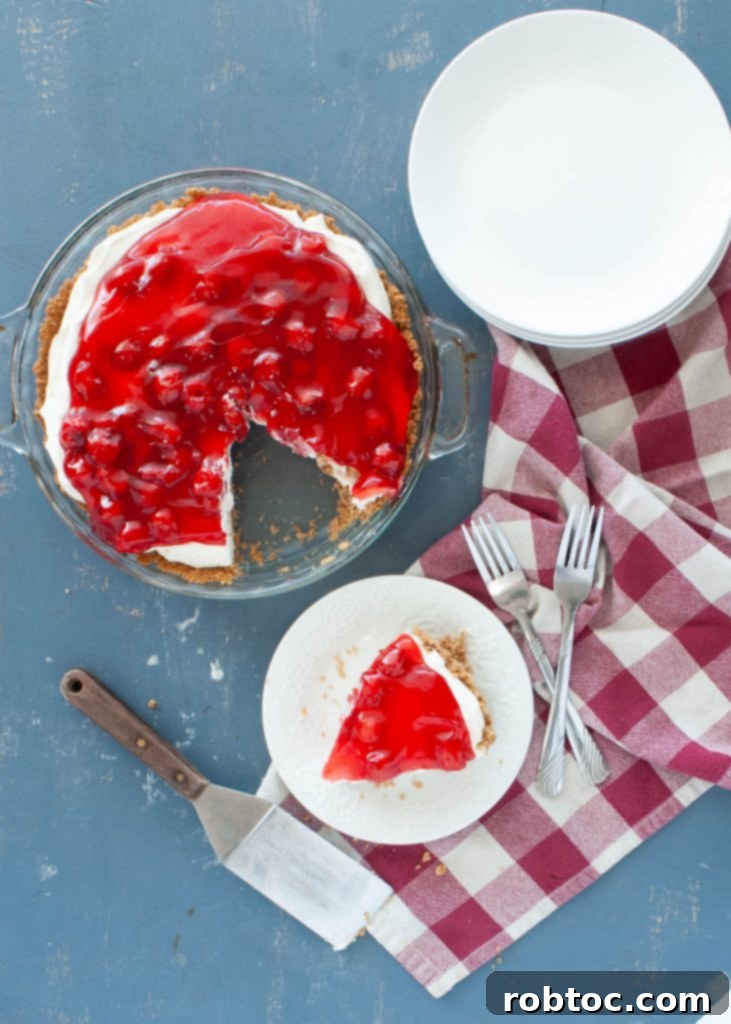 above angle of a no-bake dairy-free cherry cheesecake with a slice taken out