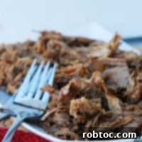 Tender Slow Cooker Balsamic Pork Roast with drippings