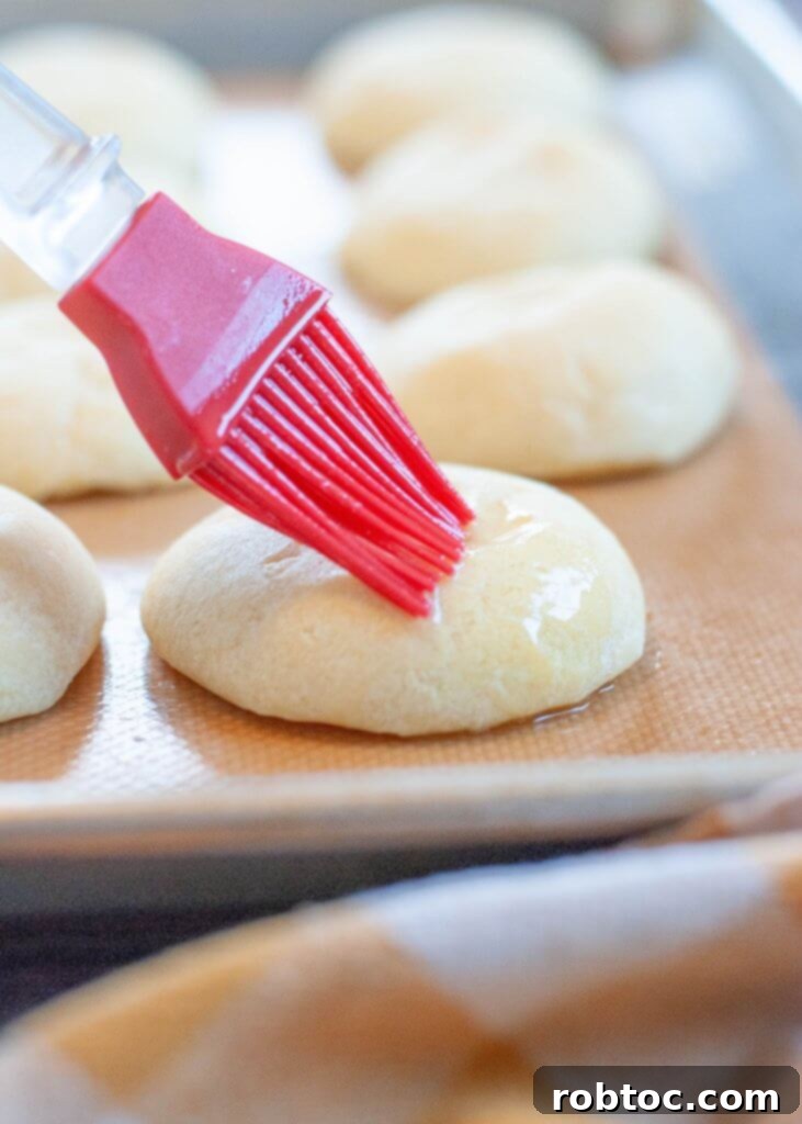 Authentic Pan De Bono Colombian Cheese Bread Recipe Video 3 pan-de-bono-getting-melted-butter-brushed-on-top