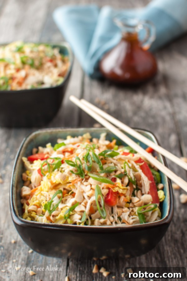 Asian Chicken Salad with Spicy Sriracha Dressing - A zesty and protein-packed salad.