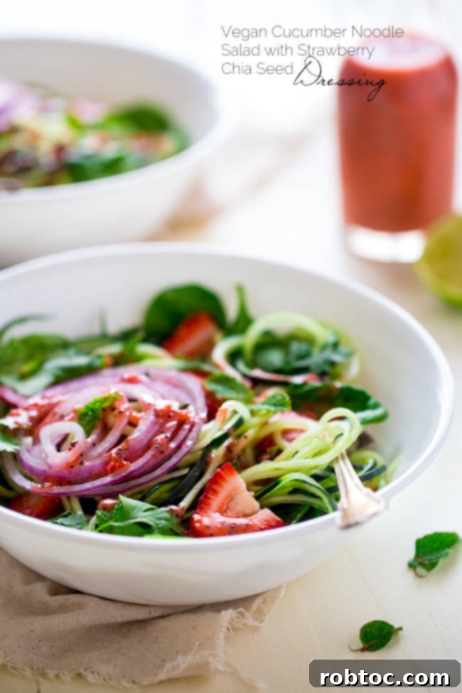 Spiralized Cucumber Salad with Chia Seed Strawberry Vinaigrette - A light, vibrant, and innovative salad.