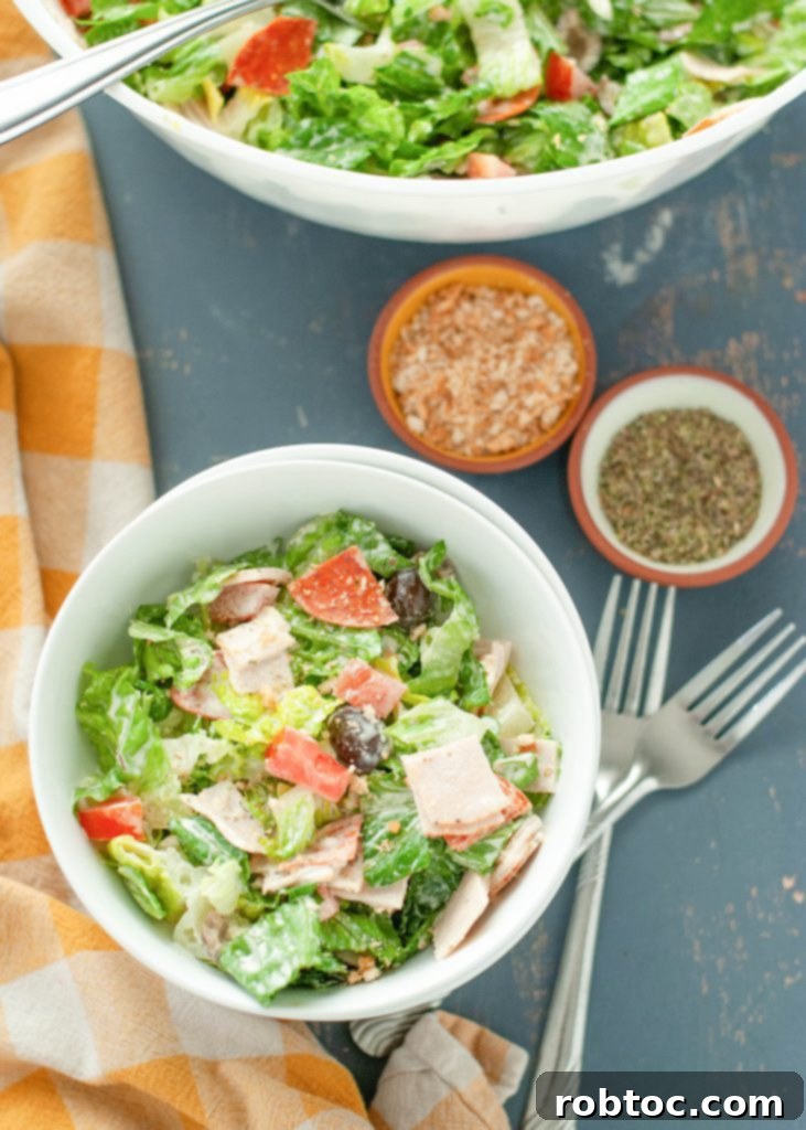 overhead shot of a gluten-free, dairy-free Italian grinder salad presented beautifully in a white bowl