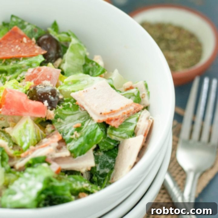 close-up view of a vibrant Italian chopped salad in a white bowl